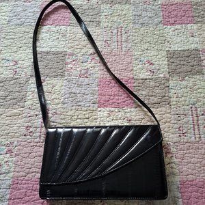 Vintage sleek black eel skin purse.